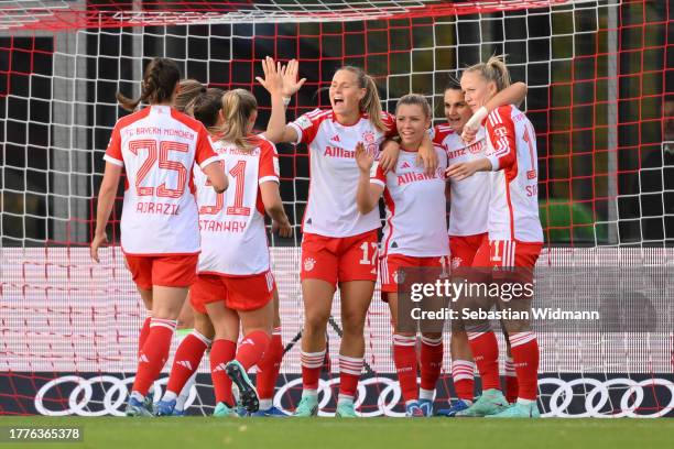 Linda Dallmann of FC Bayern München celebrates with team mates Klara Buehl, Jovana Damnjanovic and Lea Schueller after scoring her team's first goal...
