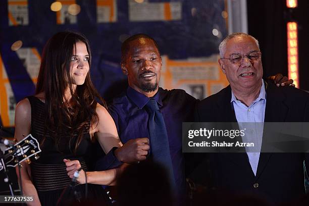 Katie Holmes, Jamie Foxx and Colion Powell perform at the 4th Annual Apollo In The Hamptons Benefit on August 24, 2013 in East Hampton, New York.