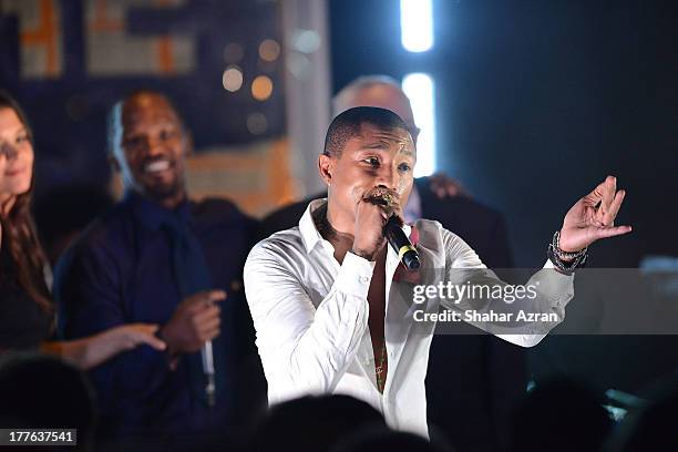 Pharrell performs at the 4th Annual Apollo In The Hamptons Benefit on August 24, 2013 in East Hampton, New York.