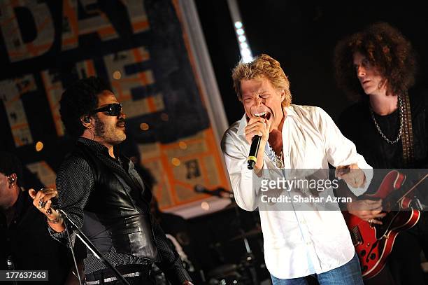 Jon Bon Jovi and Lenny Kravitz perform at the 4th Annual Apollo In The Hamptons Benefit on August 24, 2013 in East Hampton, New York.
