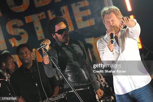 Jon Bon Jovi and Lenny Kravitz perform at the 4th Annual Apollo In The Hamptons Benefit on August 24, 2013 in East Hampton, New York.