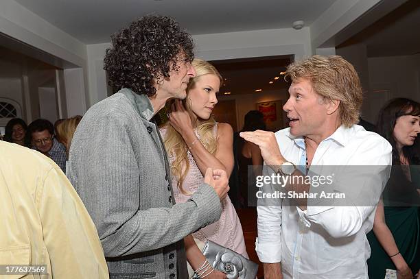Jon Bon Jovi, Beth and Howard Stern attend 4th Annual Apollo In The Hamptons Benefit on August 24, 2013 in East Hampton, New York.