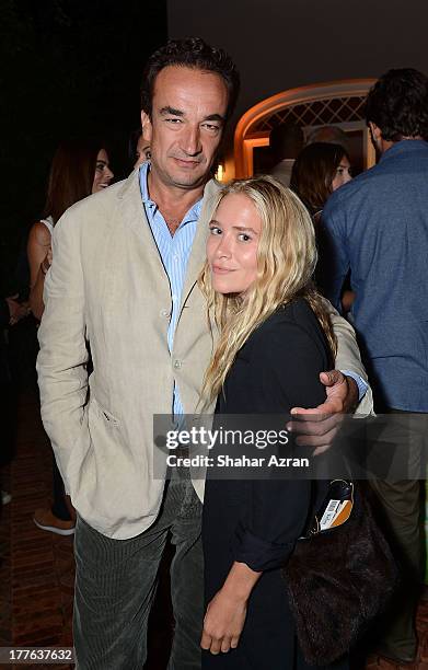 Olivier Sarkozy and Mary Kate Olsen attend 4th Annual Apollo In The Hamptons Benefit on August 24, 2013 in East Hampton, New York.