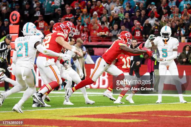 Rashee Rice of the Kansas City Chiefs scores an 11 yard touchdown in the first quarter during the NFL match between Miami Dolphins and Kansas City...