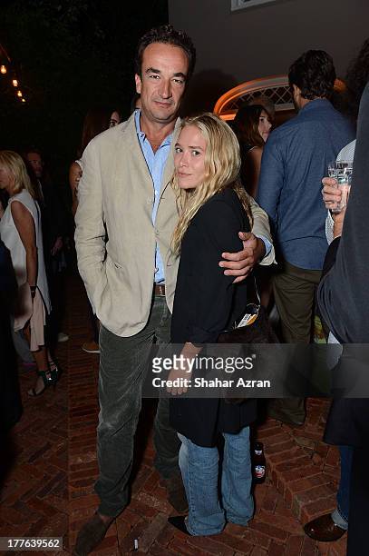 Olivier Sarkozy and Mary Kate Olsen attend 4th Annual Apollo In The Hamptons Benefit on August 24, 2013 in East Hampton, New York.