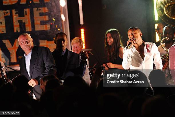 Colin Powell, Jamie Foxx, Ellen DeGeneres, katie Holmes and Pharrell Williams perform at the 4th Annual Apollo In The Hamptons Benefit on August 24,...
