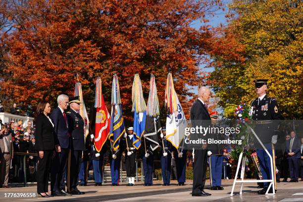 President Joe Biden, second right, lays a wreath as US Vice President Kamala Harris, from left, Denis McDonough, US secretary of Veterans Affairs ,...
