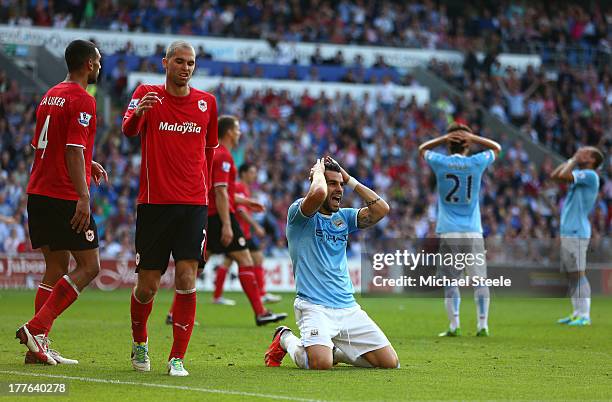 Alvaro Negredo of Manchester City and teammates react after a late missed chance on goal during the Barclays Premier League match between Cardiff...