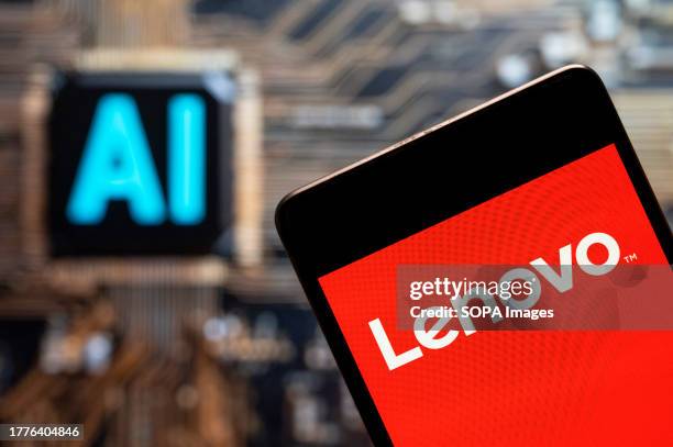 In this photo illustration, the Chinese multinational technology company Lenovo logo seen displayed on a smartphone with an Artificial intelligence...