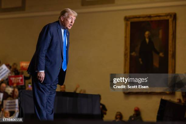 Republican presidential candidate former President Donald Trump yells to the crowd before delivering remarks during a campaign event on November 11,...