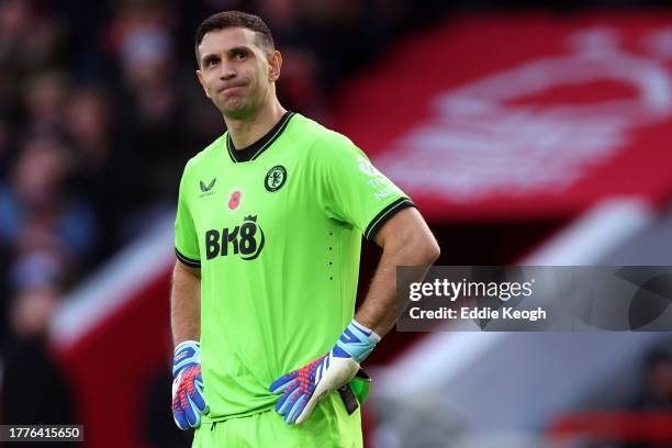 Emiliano Martinez of Aston Villa reacts as Orel Mangala of Nottingham Forest scores the team's second goal during the Premier League match between...