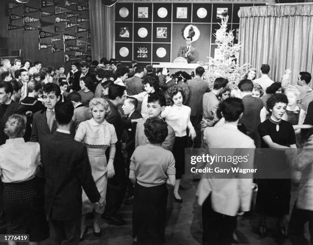 Teenagers dance on an episode of Dick Clark's television program, 'American Bandstand,' 1950s.