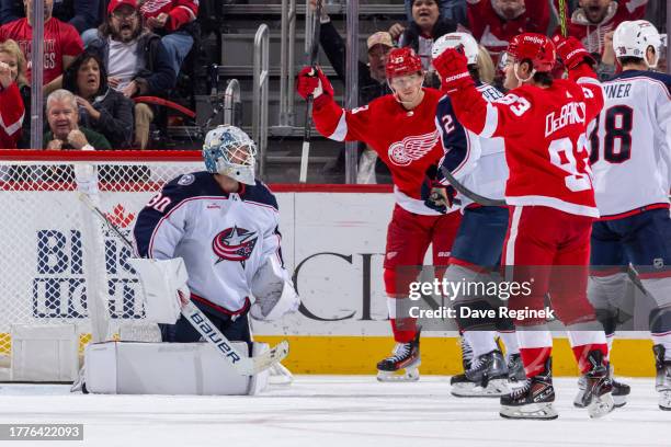 Alex DeBrincat of the Detroit Red Wings celebrates goal on Spencer Martin of the Columbus Blue Jackets during the second period at Little Caesars...