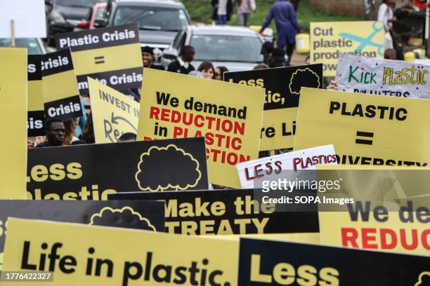 Activists from different parts of the world carry placards during a #BreakFreeFromPlastic March held in Nairobi ahead of UN's Intergovernmental...