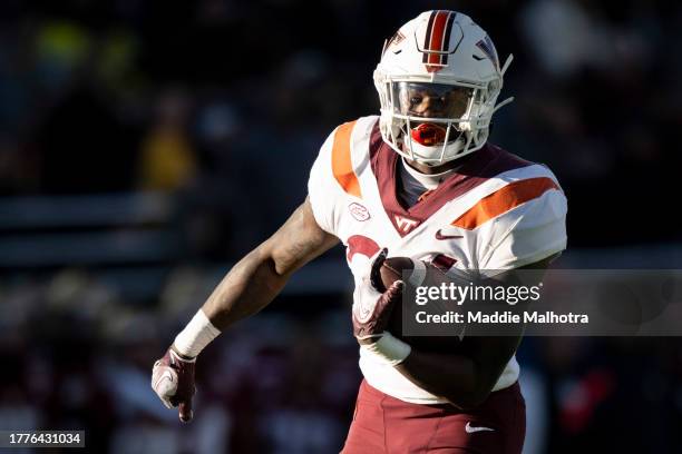 Malachi Thomas of the Virginia Tech Hokies carries the ball during the second half against the Boston College Eagles at Alumni Stadium on November...