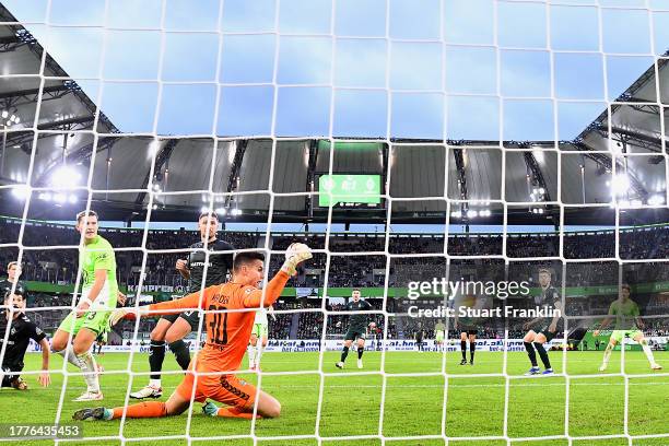 General view as Michael Zetterer of Werder Bremen fails to save a shot from Vaclav Cerny of VfL Wolfsburg which leads to VfL Wolfsburg's first goal...