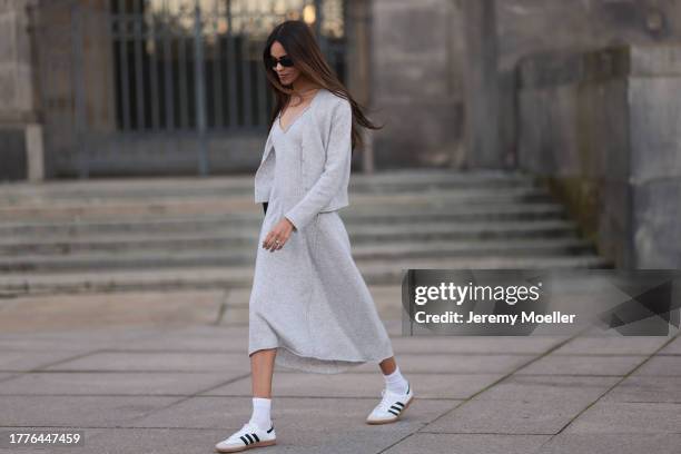 Jill Asemota seen wearing black vintage sunglasses, Dorothee Schumacher grey wool knit long dress, matching Dorothee Schumacher grey wool knit...
