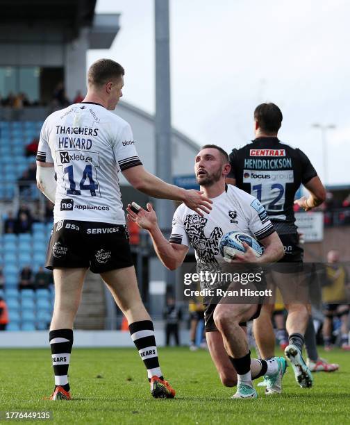 Rich Lane of Bristol Bears celebrates scoring his team's second try with teammate Noah Heward during the Gallagher Premiership Rugby match between...