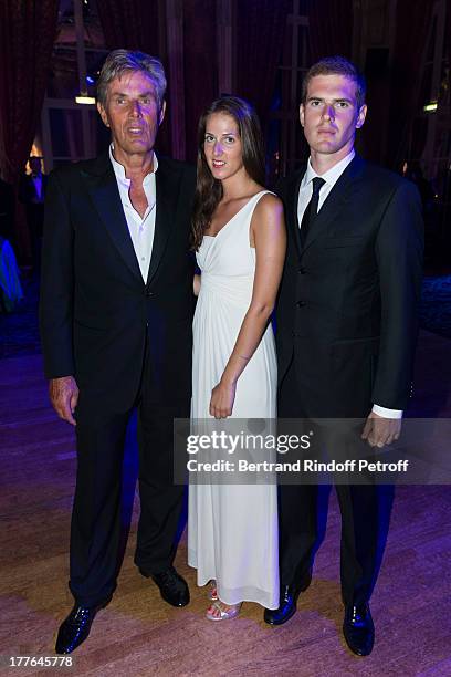 President of Barriere Group Dominique Desseigne, his children Joy and Alexandre attend the Grand Bal Care in Deauville on August 24, 2013 in...