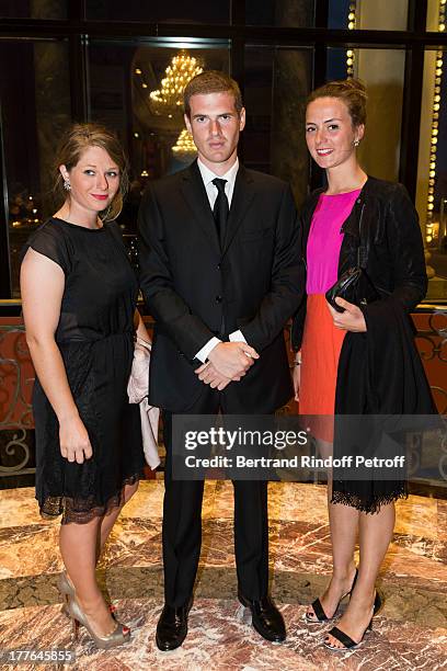 Alexandre Desseigne, the son of President of Barriere Group Dominique Desseigne, with friends Justine and Lavigna attends the Grand Bal Care In...