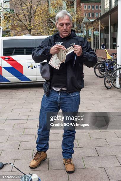 Edwin Wagensveld standing outside the court house in The Hague, tears pages from the Quran, he tore up a second copy in the court room. Edwin...