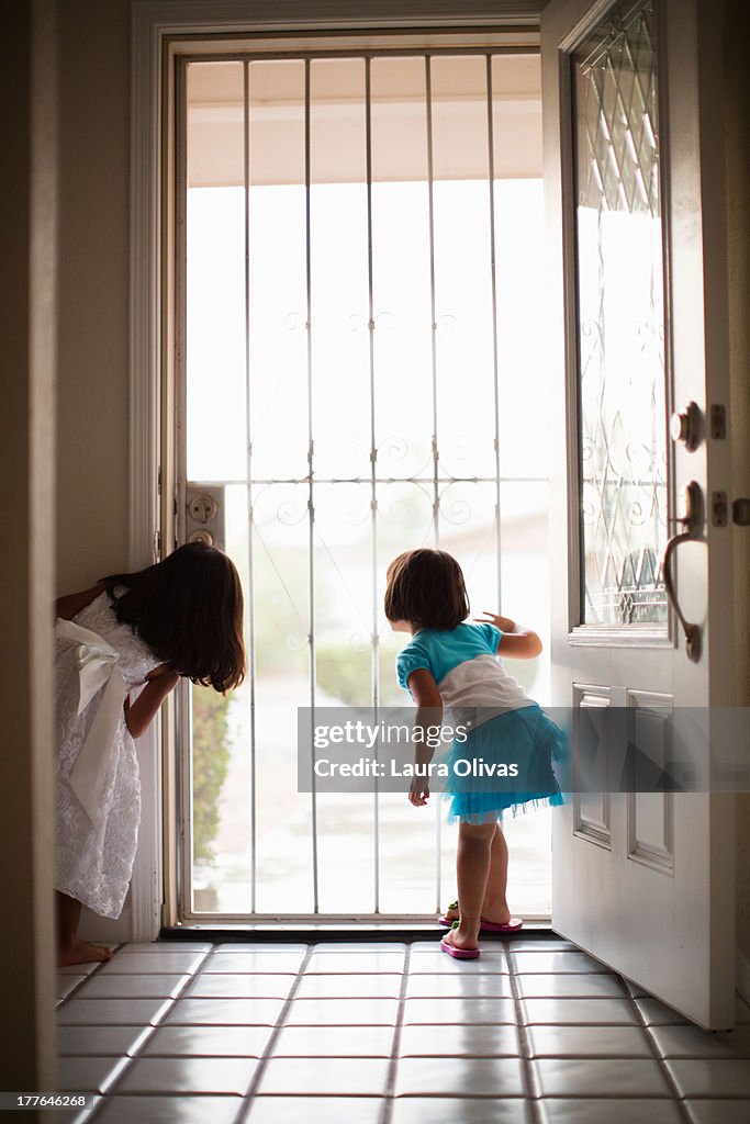 Curious Toddlers at Front Door