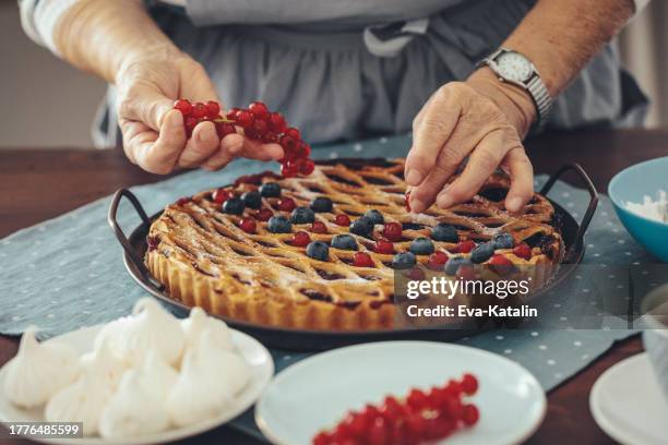 senior woman at home - cherry pie stock pictures, royalty-free photos & images