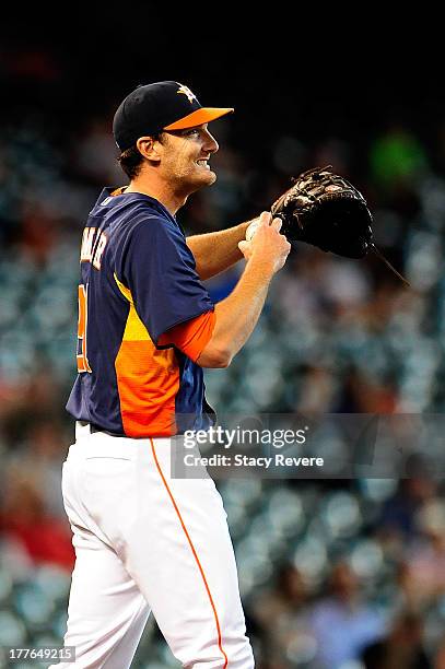 Philip Humber of the Houston Astros reacts to a pitch in the ninth inning against the Toronto Blue Jays during a game at Minute Maid Park on August...