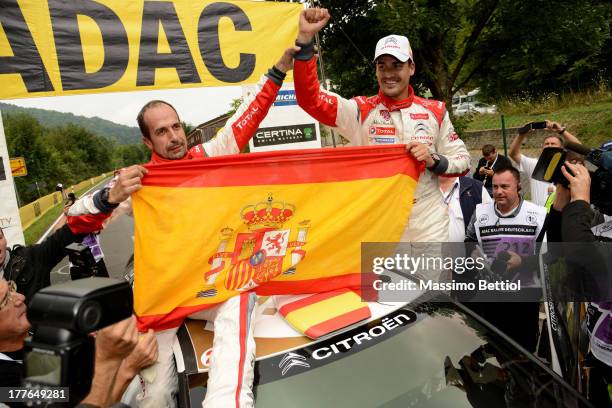 Daniel Sordo of Spain and Carlos Del Barrio of Spain celebrate their victory during Day Four of the WRC Germany on August 25, 2013 in Trier, Germany.