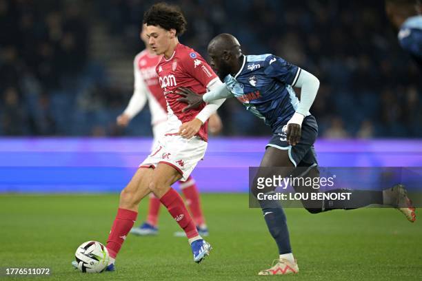 Le Havre's French midfielder Abdoulaye Toure fights for the ball with Monaco's French midfielder Maghnes Akliouche during the French L1 football...
