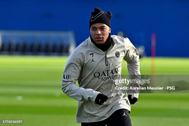 Kylian Mbappe warms up during a Paris Saint-Germain training session at Campus PSG on November 05, 2023 in Paris, France.