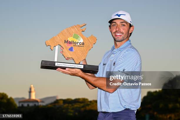 Marco Penge of England celebrates with the trophy following victory of the tournament on Day Four of the Rolex Challenge Tour Grand Final supported...