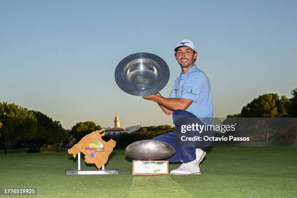 Marco Penge of England celebrates with the trophys following victory of the tournament on Day Four of the Rolex Challenge Tour Grand Final supported...