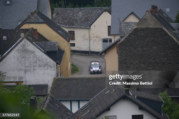 Thierry Neuville of Belgium and Nicolas Gilsoul of Belgium compete in their Qatar WRT Ford Fiesta RS WRC during Day Four of the WRC Germany on August...