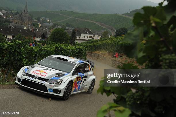 Sebastien Ogier of France and Julien Ingrassia of France compete in their Volkswagen Motorsport Polo R WRC during Day Four of the WRC Germany on...