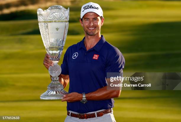 Adam Scott of Australia poses with the trophy after winning The Barclays at Liberty National Golf Club on August 25, 2013 in Jersey City, New Jersey.