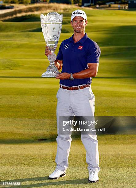 Adam Scott of Australia poses with the trophy after winning The Barclays at Liberty National Golf Club on August 25, 2013 in Jersey City, New Jersey.