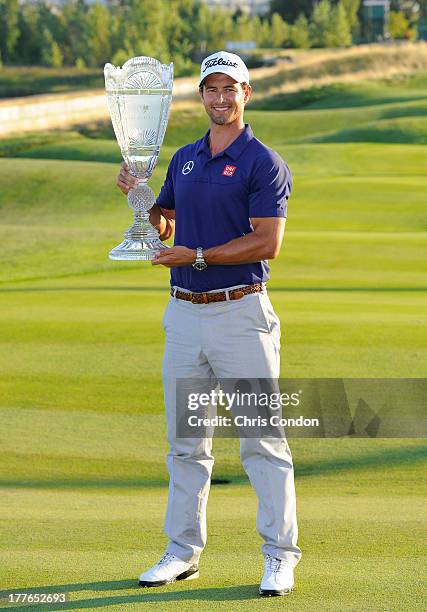 Adam Scott of Australia holds the tournament trophy after winning The Barclays at Liberty National Golf Club on August 25, 2013 in Jersey City, New...