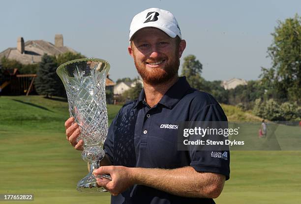 Bronson La'Cassie of Australia holds up the trophy after winning the Cox Classic Presented by Lexus of Omaha at Champions Run on the 3rd hole of a...