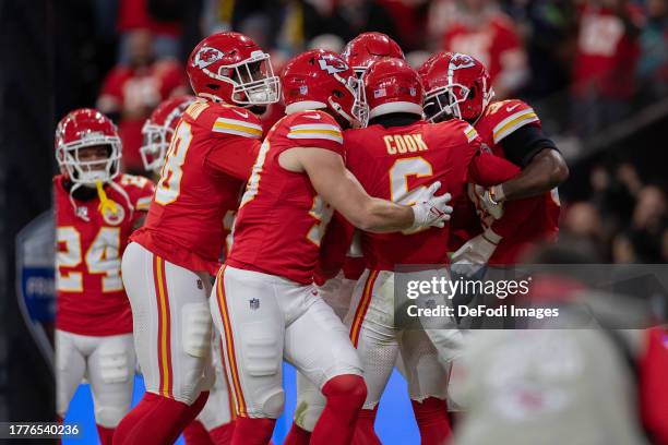 Chris Oladokun of Kansas City Chiefs celebrates with his teammates after scoring a touchdown during the NFL match between Miami Dolphins and Kansas...
