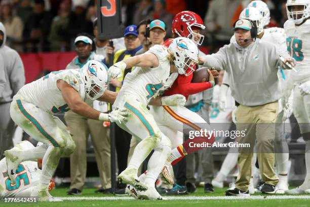 Patrick Mahomes of the Kansas City Chiefs is pushed out of bounds by Andrew Van Ginkel of the Miami Dolphins in the third quarter during the NFL...