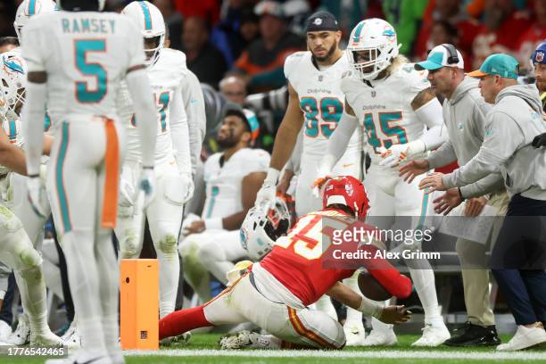 Patrick Mahomes of the Kansas City Chiefs is pushed out of bounds by Andrew Van Ginkel of the Miami Dolphins in the third quarter during the NFL...