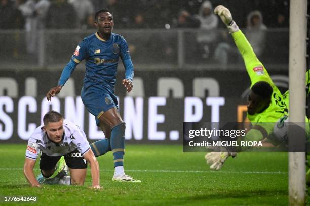 Porto's Nigerian defender Zaidu Sanusi scores a goal during the Portuguese League football match between Vitoria Guimaraes SC and FC Porto at the Dom...