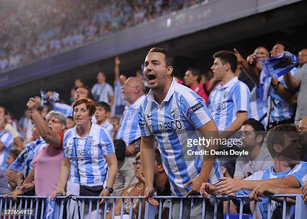Malaga CF fans react during the La Liga match between Malaga CF and FC Barcelona at La Rosaleda Stadium on August 25, 2013 in Malaga, Spain.