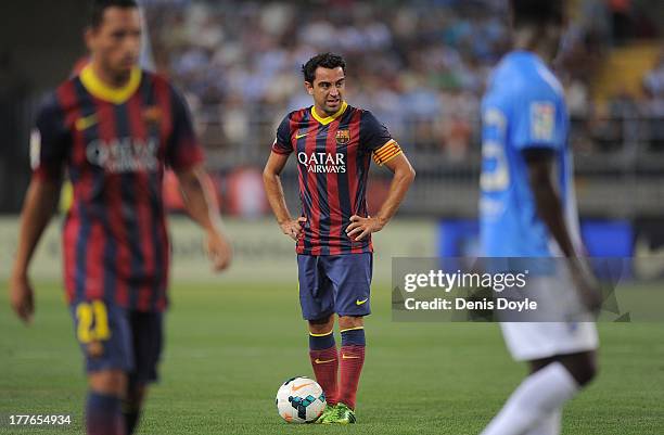 Barcelona captain Xavi Hernandez gets ready to take a free kick during the La Liga match between Malaga CF and FC Barcelona at La Rosaleda Stadium on...