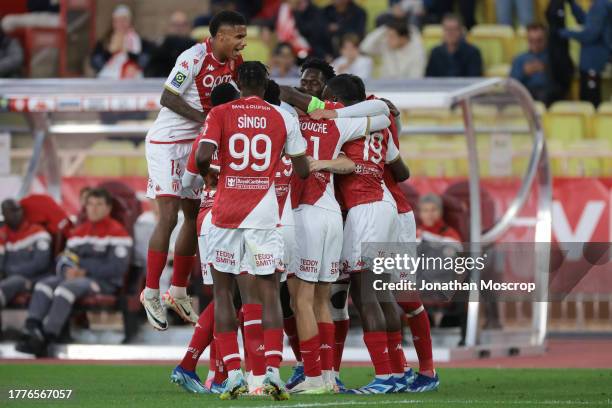 Denis Zakaria of AS Monaco celebrates with team mates after scoring to give the side a 1-0 lead during the Ligue 1 Uber Eats match between AS Monaco...