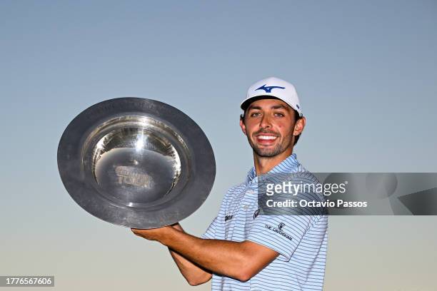 Marco Penge of England celebrates with the trophy following victory of the tournament on Day Four of the Rolex Challenge Tour Grand Final supported...