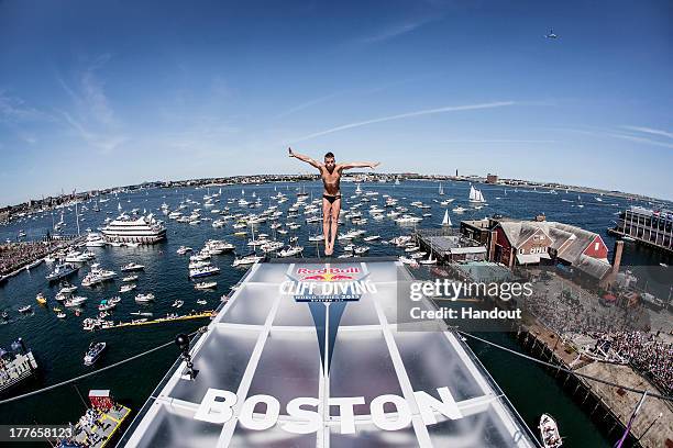 In this handout image provided by Red Bull, Artem Silchenko of Russia dives from the 27.5 metre platform on the ICA building at Fan Pier during the...