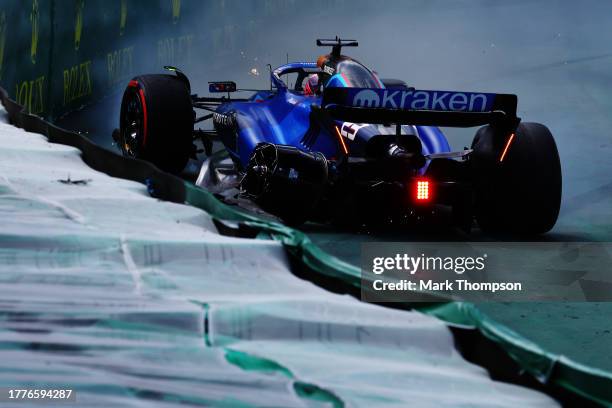 Alexander Albon of Thailand driving the Williams FW45 Mercedes spins off track after a collision with Kevin Magnussen of Denmark driving the Haas F1...