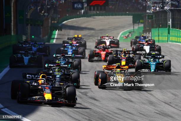 Max Verstappen of the Netherlands driving the Oracle Red Bull Racing RB19 leads Lewis Hamilton of Great Britain driving the Mercedes AMG Petronas F1...